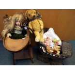 A wooden metamorphic doll's high-chair with a ceramic faced doll entitled 'Lily Sitting' by the