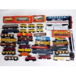 Model Railways - in excess of 40 predominantly unboxed OO gauge wagons by Hornbyand Tri-Ang,