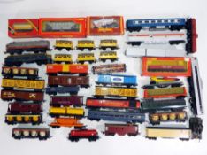 Model Railways - in excess of 40 predominantly unboxed OO gauge wagons by Hornbyand Tri-Ang,