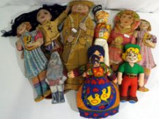 A good collection of nine cloth dolls to include a Sergeant at Arms soldier doll,