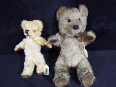 A mohair vintage bear with jointed head, arms and legs, velour pads on hands and feet,