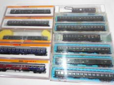 Arnold, Atlas and Roco N gauge - twelve passenger carriages, maroon and cream livery,