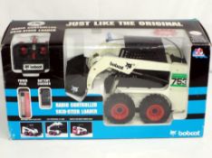 Radio Controlled - a large scale boxed radio controlled Skid Steer Loader by Bobcat,