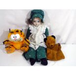 Vintage Toys - a vintage Chad Valley Sooty puppet, a Garfield and a bisque headed doll,