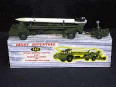 Diecast - a Dinky missile with Corporal missile launching platform in original box,