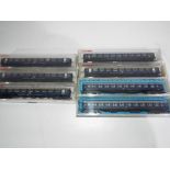 Fleischmann and Roco N gauge - seven passenger carriages, maroon and cream livery,