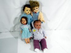 A collection of four mid century dolls to include a girl Roddy Doll approx 30cm (h),