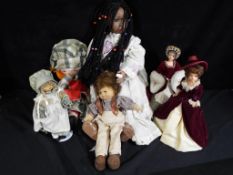 A collection of dolls to include Angela Ferrow by Denise marked 9/99 to the head,