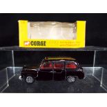 Corgi - A boxed Corgi Whizzwheels #418 Austin London Taxi in black with red interior,