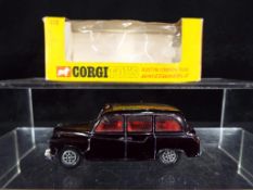 Corgi - A boxed Corgi Whizzwheels #418 Austin London Taxi in black with red interior,