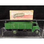 Dinky Supertoys - A boxed Dinky Supertoys #511 Guy 4 - Ton Lorry in green with black chassis,