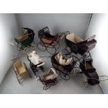 Dolls House miniatures - a collection of eight quality hand made reproduction prams some with