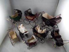 Dolls House miniatures - a collection of eight quality hand made reproduction prams some with