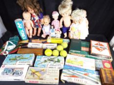 A good mixed lot to include dolls, board games, dominoes, table tennis set and six model kits,