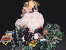 A mixed lot to includes a doll, small collection of diecast vehicles,