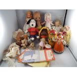 A good mixed collection of vintage dolls to include a plastic Kewpie doll,