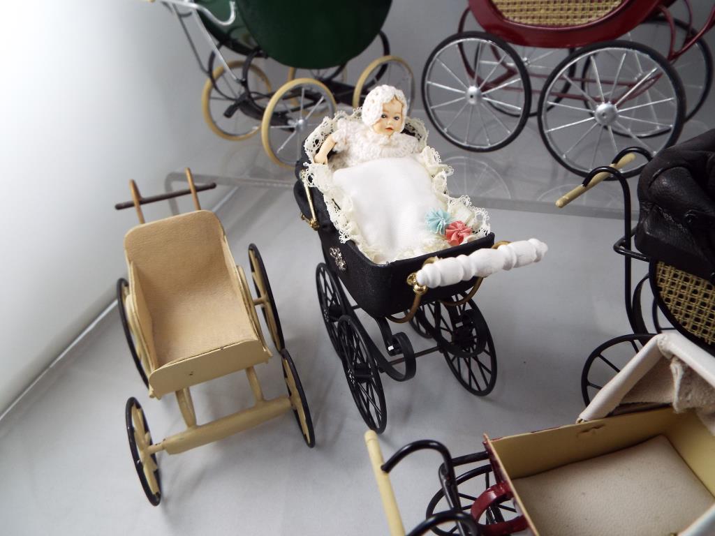 Dolls House miniatures - a collection of eight quality hand made reproduction prams some with - Image 3 of 4