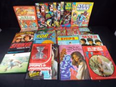 A good mixed lot of 21 hard back books and comics, including five Marvel comic,