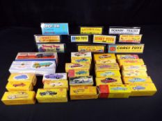 Diecast - Dinky - 26 reproduction empty boxes and ten plastic displays,