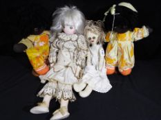A collection of four good quality cloth dolls two with stands (4)