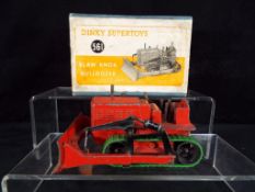 Dinky Supertoys - A boxed Dinky Supertoys #561 Blaw Knox Bulldozer in red with green tracks,