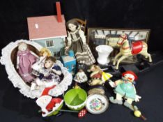 A good mixed lot to include miniature ceramic dolls, a wooden rocking horse, a wooden house,