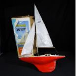 Tri-ang - a twenty four inch Tri-ang racing yacht being a scale model of an ocean cabin racer,