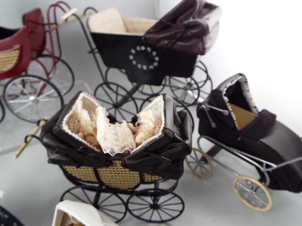 Dolls House miniatures - a collection of eight quality hand made reproduction prams some with - Image 2 of 4