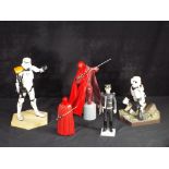 Star Wars - Three 12 inch Star Wars figures and one 7 inch figure.