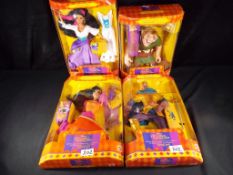 Disneyana - a collection of boxed Disney dolls to include Magic View Quasimodo by Mattel,