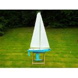 A wooden pond yacht, named Special Lady, battery powered on stand, approximately 177 cm height,