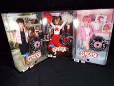 Barbie by Mattel - three Barbie Collector dolls for the 30 Year Anniversary of Grease to include