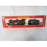 Hornby - an OO scale model 4-6-0 County Class locomotive and tender,