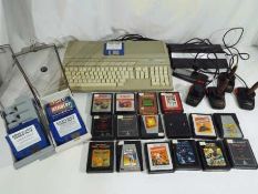 Vintage gaming - an Atari 520ST personal computer with a quantity of game and program discs to