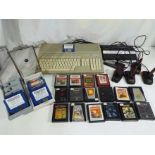 Vintage gaming - an Atari 520ST personal computer with a quantity of game and program discs to