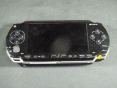 Sony - a Sony PSP hand held games console in playworn condition, untested,