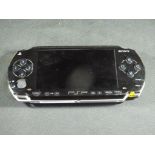 Sony - a Sony PSP hand held games console in playworn condition, untested,