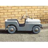 A 1960s Triang Land Rover series I pedal car in a grey finish, signs of previous restoration,