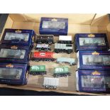 Bachmann and Hornby - 16 OO scale items of goods rolling stock of which seven Bachmann appear m or