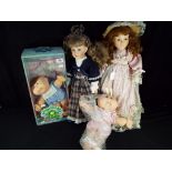 A collection of dolls to include two Cabbage Patch Kids, one boxed and two ceramic collector dolls,