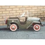 A 1960s Triang Jeep pedal car in good overall condition, mainly original paint in US army colours,