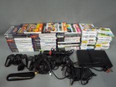 Playstation - A Sony Playstation 2 Slim console with quantity of games for PS2,