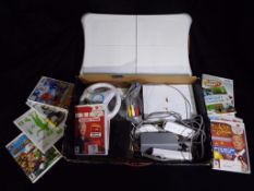 Nintendo - A Nintendo Wii games console, with Wii Fit Board,