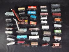 Hornby and Others - In excess of 30 unboxed Freight OO gauge rolling stock by Hornby and others.