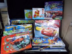 Scalextric Hot Wheels and others - 4 boxed slot car racing sets by Scalextric,