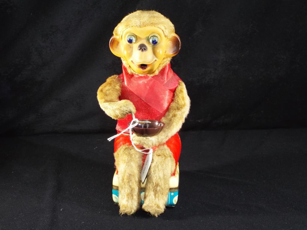 Cragston Japanese unboxed battery operated tin plate monkey,