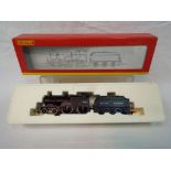 Hornby - an OO gauge model 4-4-0 locomotive and tender, class 2P, op no 40634, BR black livery,