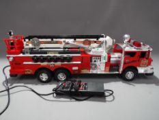 New Bright - A large battery operated American Fire Engine by New Bright,