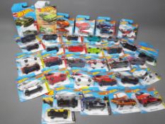 Diecast Vehicles - a collection of 36 Hot Wheel cars in blister packs