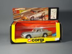 Corgi - a boxed 1:36 scale Corgi 271 James Bond Aston Martin in Red / Orange Window box with cream